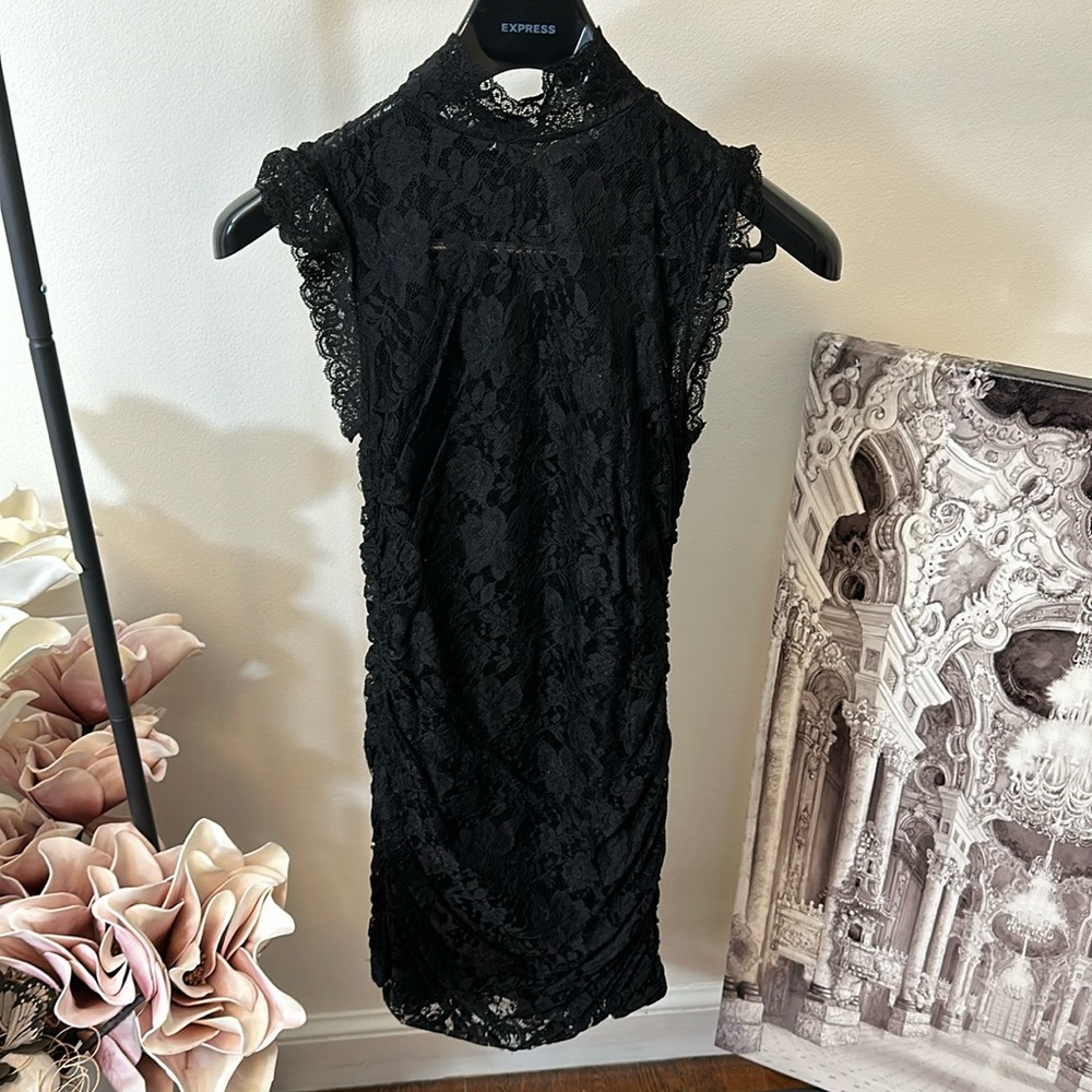 Black, sleeveless lace mini dress with ruffle neck